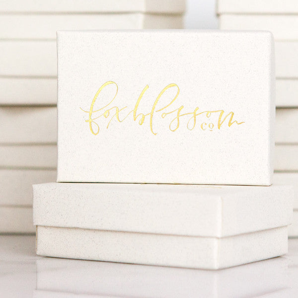 letterpressed gift packaging, gold foil boxes